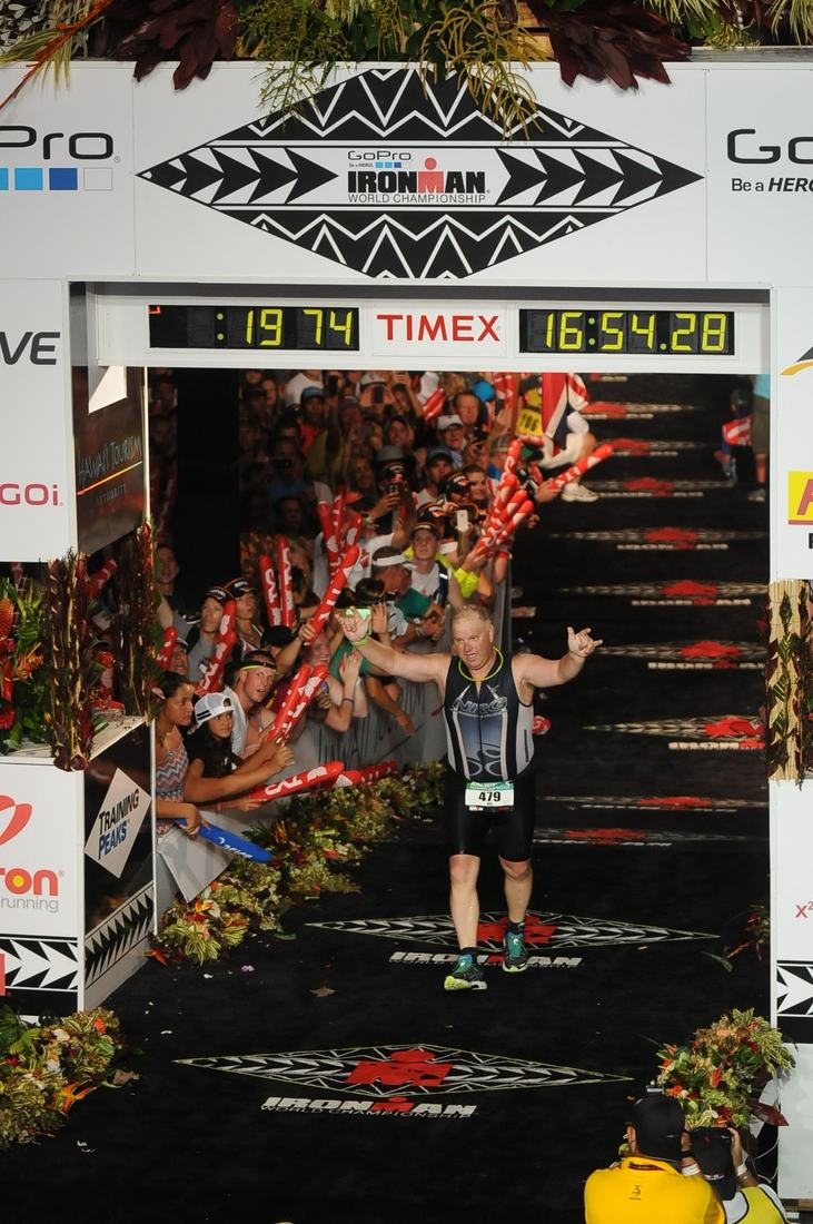 Bill Best crossing the finish line at the 2013 Ironman World Championship